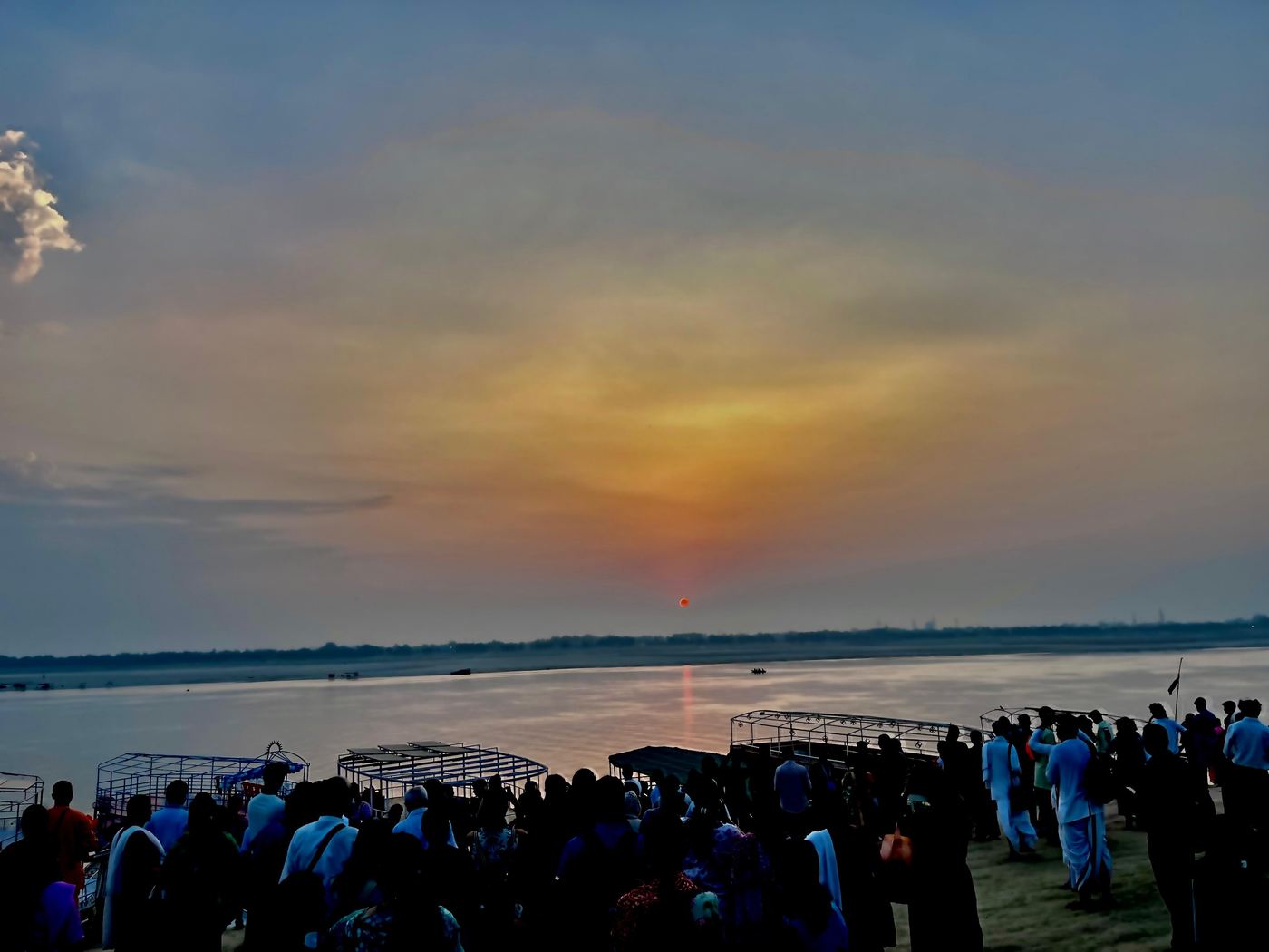 Evolve Pune pilgrims by the river at a holy place in India